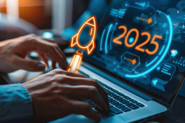 Hands typing on a laptop with a digital display showing “2025” and a rocket icon, symbolizing innovation and future technology. New year 2025