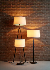 a set of three lamps positioned against a backdrop of a textured brick wall in a highly detailed thr