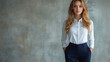 © Inna - Professional woman with confident pose in business attire against textured background