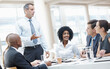 © STEEXBuyout/peopleimages.com - Businessman, presentation and brainstorming with team in meeting for corporate plan or project at office. Man, executive or speaker talking to group of employees for business campaign or development