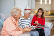 © Dragana Gordic - Elderly Friends Enjoying Cake at a Birthday Celebration
