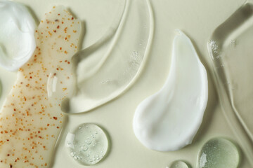 Poster - Smears of different cosmetic products on white background, flat lay