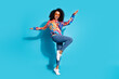 © deagreez - Full size photo of pretty young girl sunglass dance discotheque wear trendy colorful outfit isolated on blue color background