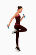 © Prostock-studio - Afro Fitness Lady Exercising Jumping With Dumbbells On White Studio Background. Full Length, Isolated
