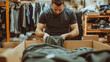© Oleksandr - Entrepreneur preparing clothing for export in a delivery box, focusing on retail and e-commerce.