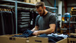 © Oleksandr - Entrepreneur preparing clothing for export in a delivery box, focusing on retail and e-commerce.