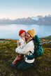 © EVERST - Mother hugging child traveling in Norway family vacation hiking in mountains activity together, healthy lifestyle outdoor woman having fun  with kid love and happiness candid emotions, Mothers day