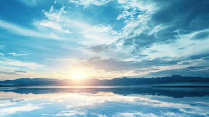 Wall Mural - a beautiful blue sky with a sun setting in the distance