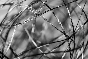 Aufkleber - An intricate and artistic composition of interwoven black and white wires, creating an abstract visual pattern full of depth and complexity with a modern touch.