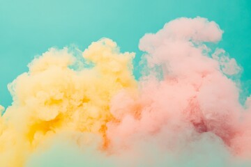 A vibrant collection of yellow and pink smoke clouds delicately intertwines for a breathtaking visual, set against an eye-catching turquoise background.