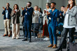 © Jacob Lund - Diverse group of coworkers applauding at a business conference presentation
