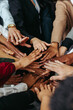 © Jacob Lund - Multiethnic teamwork showing unity with diverse hands working together in a group environment to achieve a common goal