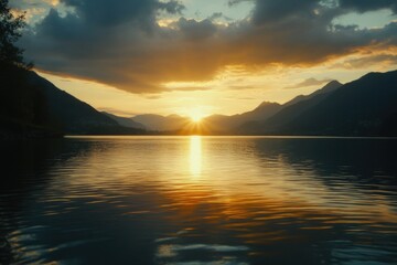 Poster - A serene scene of sunset over a lake with mountains in the background