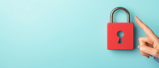 A hand points toward a red padlock against a light blue background, symbolizing security and protection.