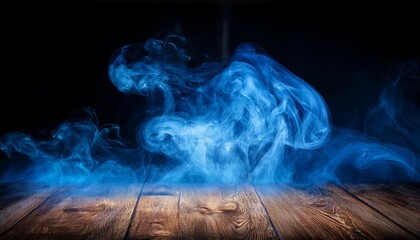 conceptual image of blue smoke isolated on dark black background and wooden table