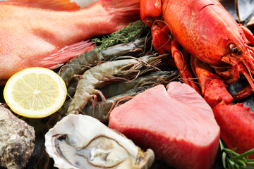 Sticker - Whole fresh raw lobster and other sea food as background, closeup