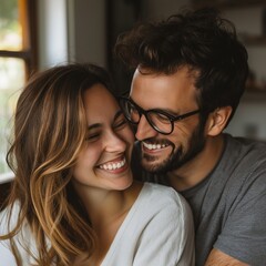 A joyful couple shares a happy moment in a cozy setting, conveying warmth and love.