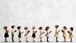 © Kritsada - Watercolor Christmas carolers in minimalistic silhouettes, soft tones, on a light gray background, seamless repeat