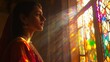 © Life in India - Woman in traditional attire admiring stained glass window with sunlight reflections