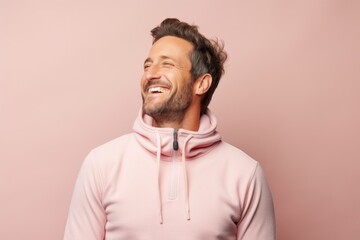 Sticker - Portrait of a blissful man in his 30s wearing a thermal fleece pullover over pastel or soft colors background