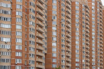 Fragment of a modern multi-storey building facade. Concept of urban life, construction, industry