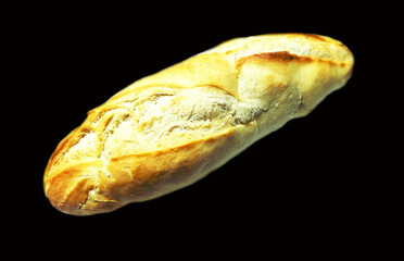 Fresh tasty bread French baguette on black background. 