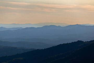 Wall Mural - mountain ranges at sunset in the haze