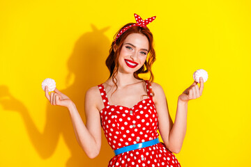 Sticker - Photo of cute pretty cheerful lady wear red stylish outfit hand hold tasty zephyr isolated on yellow color background