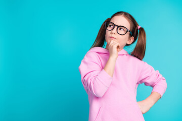 Canvas Print - Photo portrait of pretty little girl specs look thoughtful empty space wear trendy pink outfit isolated on aquamarine color background