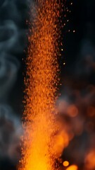 Wall Mural - rising fire sparks creating a dazzling display on a black background