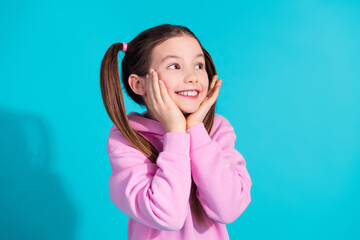 Sticker - Photo portrait of lovely little girl look empty space dreamy dressed stylish pink garment isolated on aquamarine color background