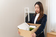 © Pormezz - Office worker packing stuff to leave office after resign from job.
