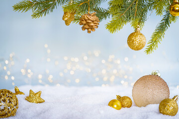 Wall Mural - christmas holiday background with snow, fir tree and decorations with christmas light behind. christ