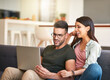 © FotoPush/peopleimages.com - Smile, couple and relax with laptop at house for financial planning, loan research and mortgage application. Happy, people and digital for banking payment, finance budget and investment with bonding
