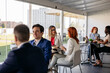 © PintoArt - Multiracial business team having lunch break in modern office