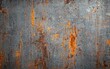 © YanabY - Textured metal surface showing intricate patterns of rust and oxidation in shades of orange and grey under natural light