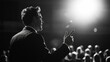© Penatic Studio - A Speaker Addressing an Audience in a Dimly Lit Hall