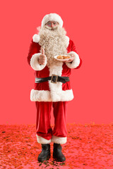 Sticker - Santa Claus with tasty falafel balls showing thumb-up on red background