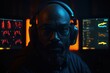 © melhak - Man with a beard wearing headphones in front of three monitors - People