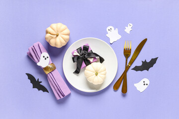 Sticker - Beautiful table setting with fresh pumpkins, gift box, paper bats and ghosts for Halloween celebration on lilac background