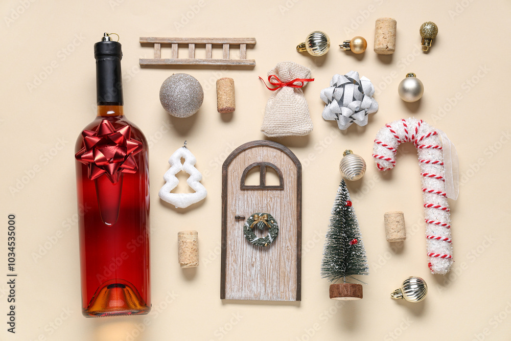 Composition with bottle of wine and Christmas decorations on beige background