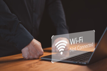 Person use a laptop computer connect for wifi, but a “Wi-Fi Not Connected” notification. Concept of the common frustration of internet connectivity issues