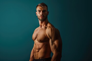 Wall Mural - muscular man confidently presenting with a solid color background, highlighting his fit physique and