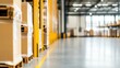 © Thanate - Warehouse interior with stacked boxes and yellow safety barriers.