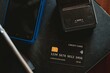 © David - A black credit card on the black cashier table