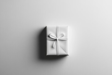 Wall Mural - A White Gift Box with a White Ribbon Bow on a White Background