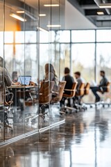 blurred view of a modern office with a team of people working at a table.