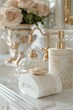 © MaMaKe - Elegant bathroom decor with a white and gold soap dispenser, soap, and a floral design.