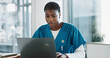 © peopleimages.com - Hospital, nurse and black woman with laptop, typing and thinking with research, online reading and internet. African person, medical or professional with computer, doctor and digital app with email