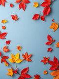 Fototapeta Zachód słońca - Autumn leaves isolated on soft blue background. Seasonal colorful fall collection artistic nature wallpaper. Copy space for text creating art vibrant seasonal pattern. Top view, flat lay. AI generated